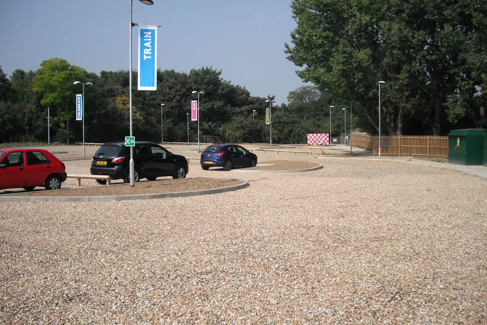 Gravel driveway with cars